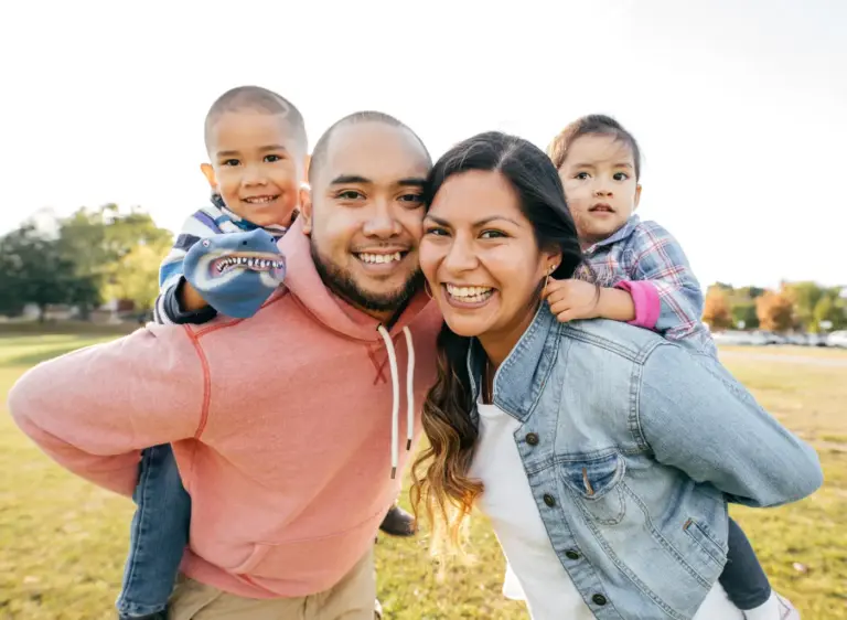 Happy family smiling together outdoors
